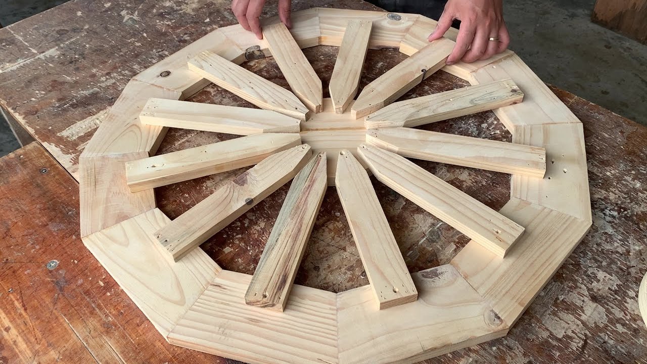 An Exquisitely Crafted Circular Wooden Planter, Dotted with Vibrant Pink and White Flowers