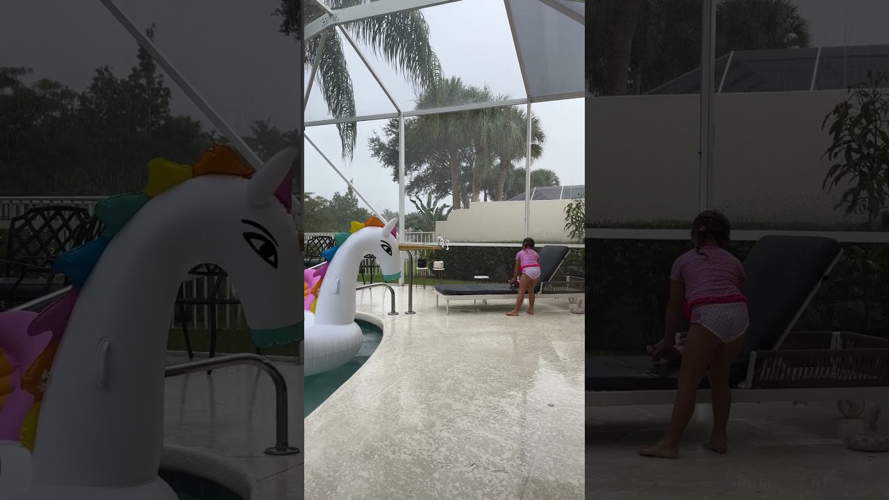 Naomi plays in the rain at the pool. Do you like playing in the rain like Naomi does at the pool?