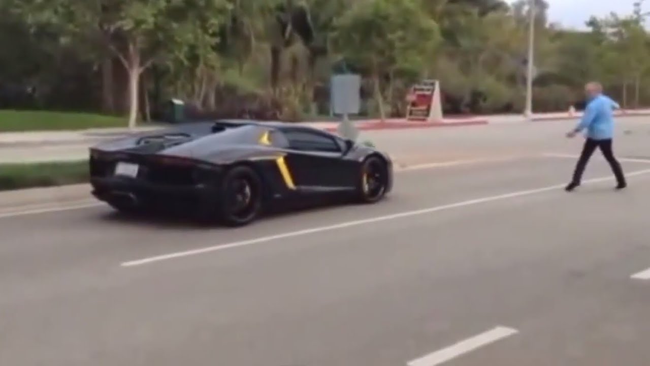 CRAZY GUY THROWS ROCK AT $500,000 LAMBORGHINI AVENTADOR SUPERCAR!!