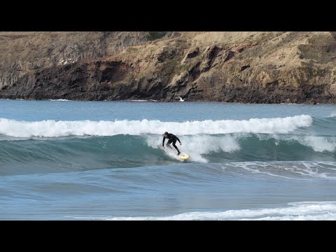 Cruising the peaks at Taylors Mistake., Taylors Mistake surf spot, Canterbury, New Zealand.