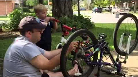 Boy and Dad and bike repair