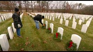 Christmas wreaths laid across Calverton National Cemetery to honor veterans for their service
