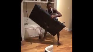 Angry man destroys his television after losing bet