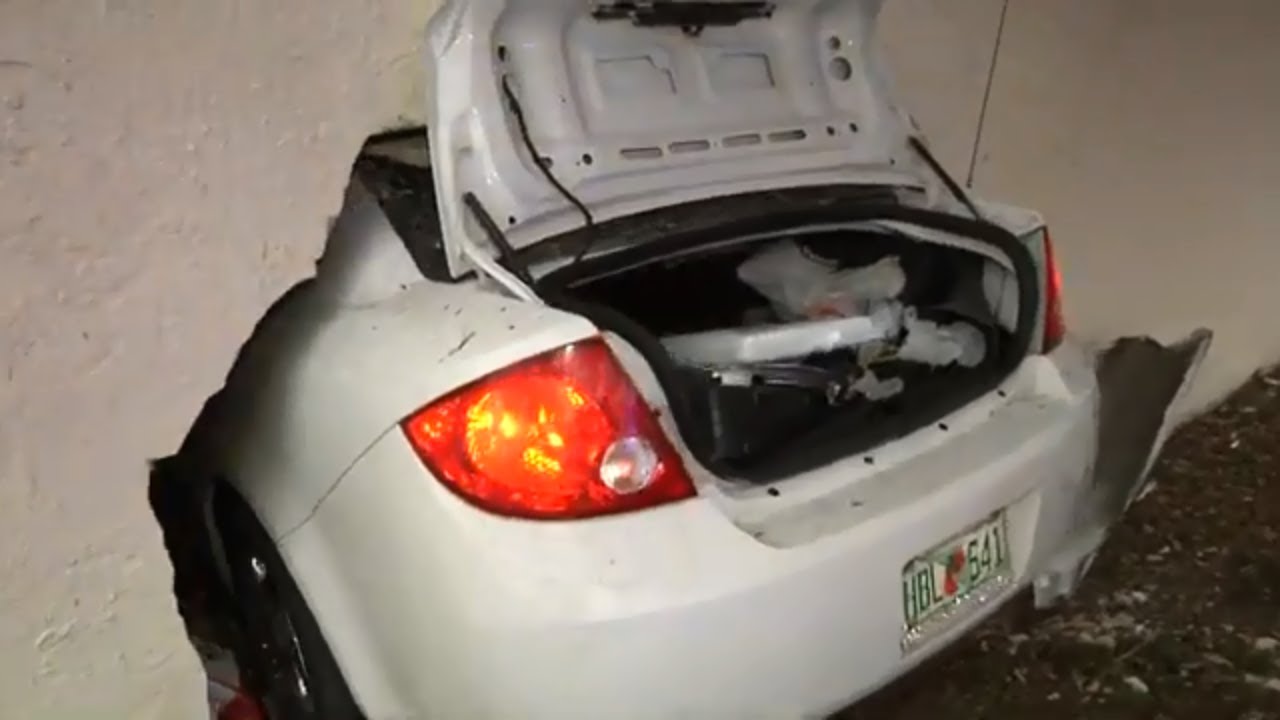 Car Crashes Into Building - Man Trapped In Wreckage Of Vehicle - Passerby Helps The Man Get Out