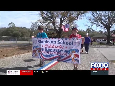Stapleton School marks America’s 250th birthday with patriotic walk, student-funded stripe repain...