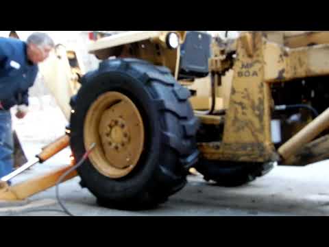 Inflating Tractor Tires on Massey Ferguson using ether, starting fluid..
