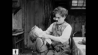 charlie chaplin-the kid-working the  streets
