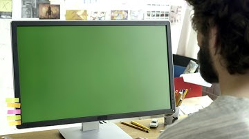 Man working on a computer with green screen Free Hd stock footage