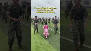 7-year-old girl performs battle dance with soldiers of PLA Navy