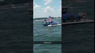 LKN Trump boat parade - sinking boat  Lake Norman