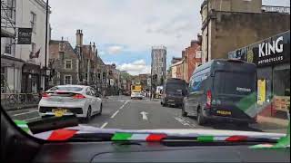 UK England's NHS Ambulance Cars Vans. A Cyclist.