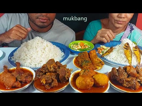 having lunch-spicy mutton curry,egg curry,chicken roast,fish curry and small fish fry eating muk