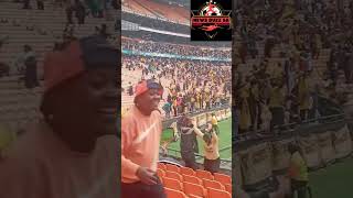 Kaizer Chiefs fans celebrating at the stadium after scoring a goal