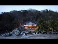 Cabana and pool by CDM cut into rocky slope on Mexico's coast
