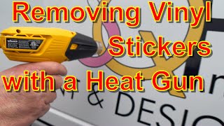 Having Fun Removing Vinyl Stickers from the Van with a Heat Gun