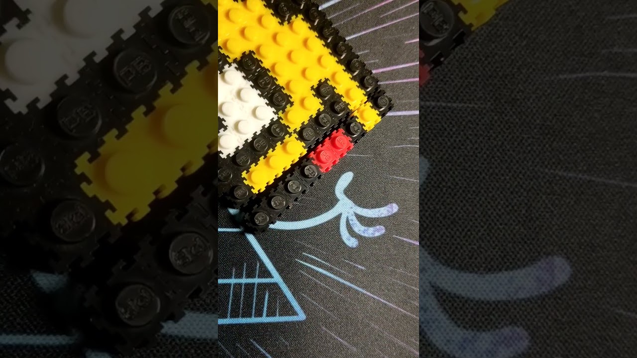 2d figure of dancing banana made with pixel blocks 