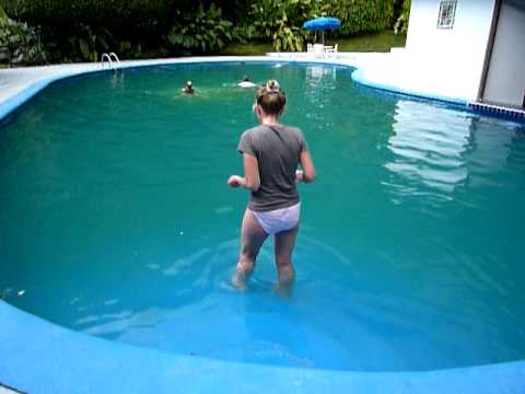 Woman swims in t-shirt and nickers