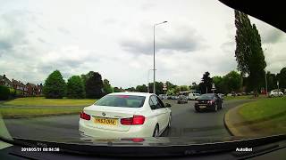 BMW Driver fails - turn right in left lane at roundabout