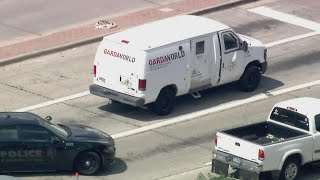 Armored car employee shot during bank robbery in Carrollton; 4 suspects in custody
