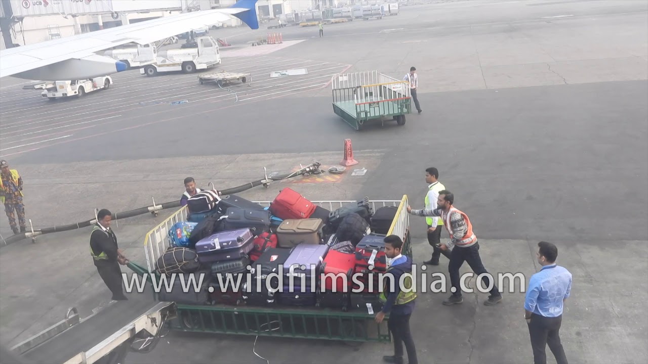 Dhaka Airport baggage handling operation, as aircraft prepares for take