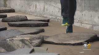 Surveying Lakefront Damage After A Storm