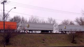 Fast CSX Van Train Westbound on Elevated Tracks