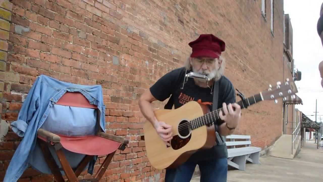 Mark Knewtson performs outside Coterie Gallery on the square in Buffalo, MO