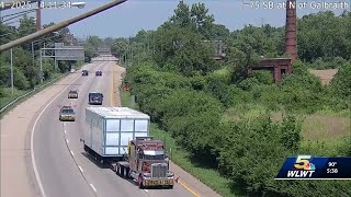 WATCH: Oversized truck forced to reverse off highway after nearly hitting overpass