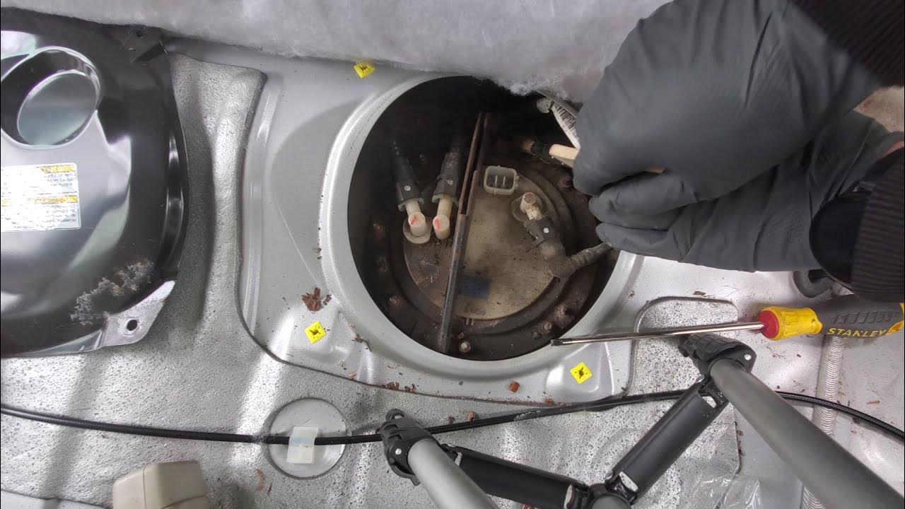 Subaru outback fuel pump location and removal - YouTube