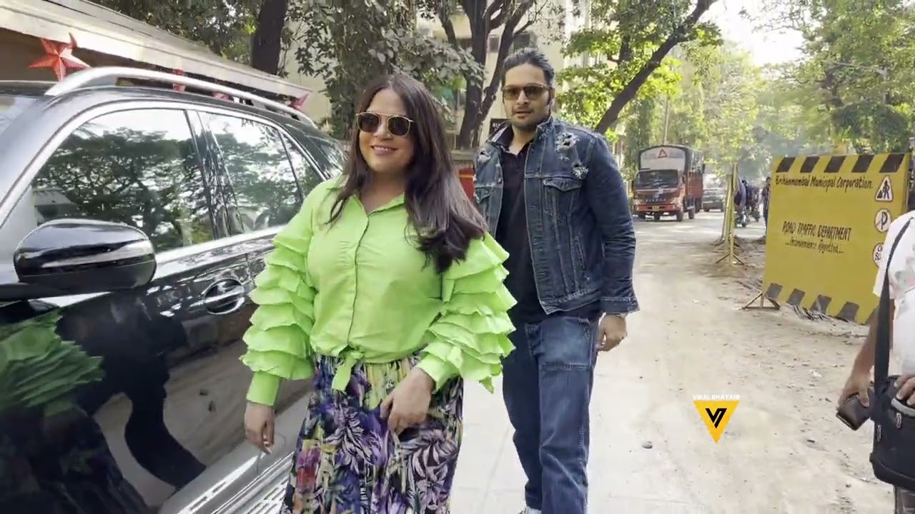 Ridhi Dogra, wearing a checkered dress and sunglasses, captured in a fashionable moment in Andheri.