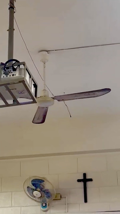 Unknown industrial ceiling fan, KDK M56XG, and various wall and portable fans