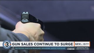 'It's actually overwhelming': As gun sales continue to surge, local shops try to keep up with demand