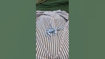 How to make a button up shirt look cute using safety pins  #styleinspo #outfitinspo #howtostyle #diy