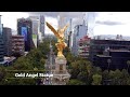 Gold angel statue in a city with skyscrapers mexico city mexico goldangelstatue mexico4k