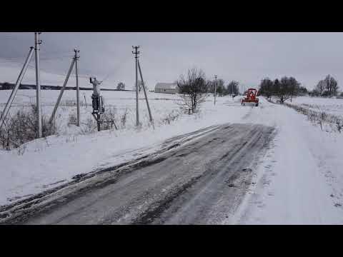 Прогорнення узбіччя автогрейдером
