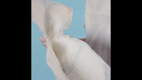 Instructions for how to apply TENA Comfort on a user standing up 1 1