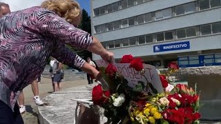Dozens of supporters of Slovak Prime Minister Robert Fico gather outside hospital