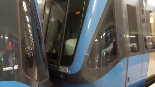 Stockholm metro car No 2000, class C20F Ficas composite. TCentralenHötorget. Text, subtitles.