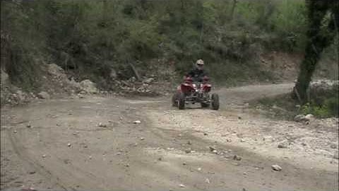 Polaris Predator 500 skiding and accelerating in a wood using several camera views