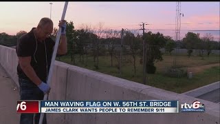 Man honors 9/11 victims with flag on I-465 overpass