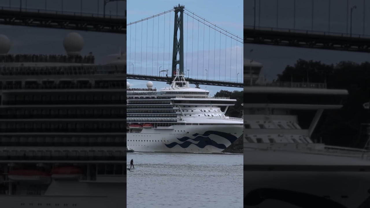 Cruise ship barely makes it passing Lions Gate bridge.