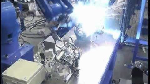 Motoman robots welding and handling automotive parts