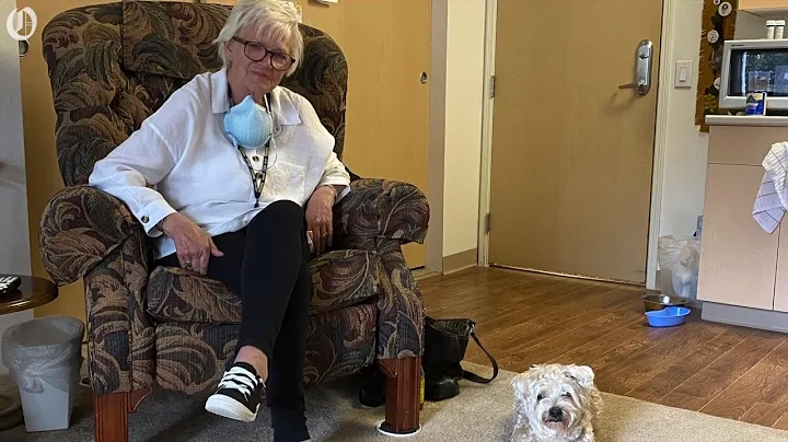 73-year-old woman is given a helping hand out of h...