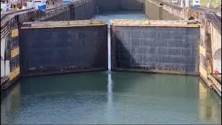 Panama Canal gates opening at one of the locks, allowing the ship to go to the next set of locks.