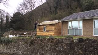 Pallet Garden house made on a budget Isle of Wight uk Built this garden chalet mainly from pallets, finished with feather edge, roofed with slates. Framework was built from large heavy duty