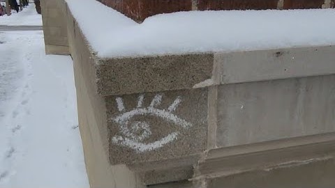 Removing Snow From Old City Ciment Wall Edge