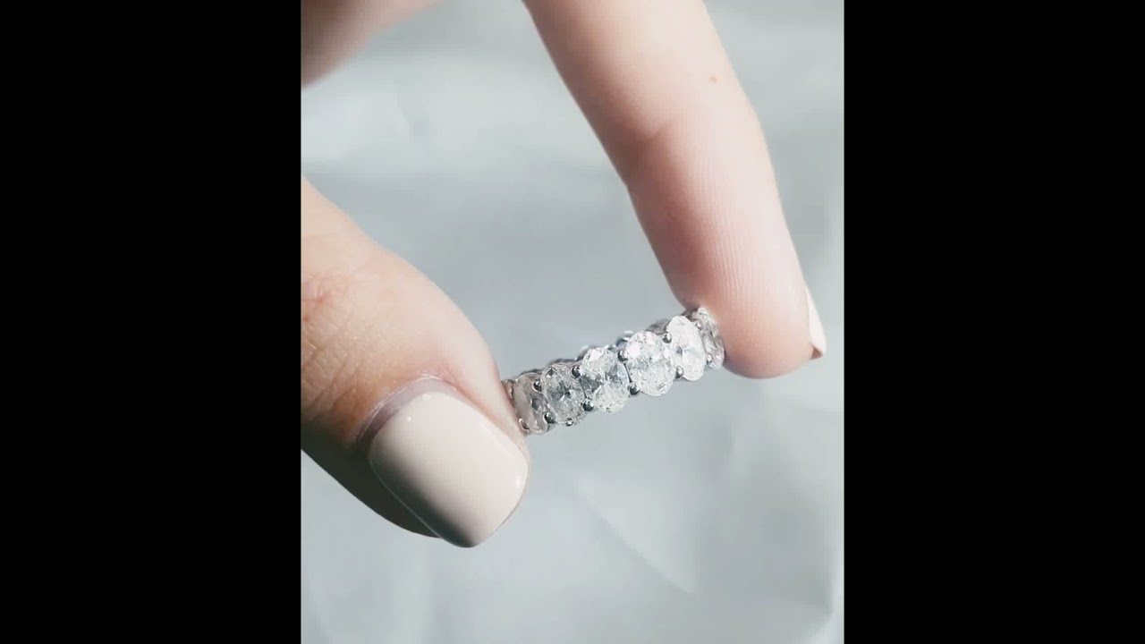 Oval cut diamond eternity ring set in 14K white gold