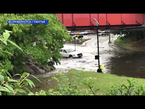 VIDEO NOW: Driver goes into flooded spot in Cranston