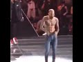 chris brown dancing on stage with usher while fans singing along