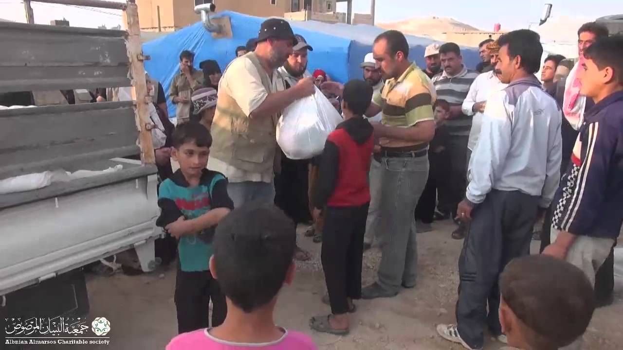 جمعية البنيان المرصوص توزيع السلل الرمضانية على مخيم النور للنازحين في عرسال رمضان 1436 هـ